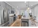 Modern kitchen with gray cabinets, stainless steel appliances, and island at 92 Kimberlite Dr, Henderson, NV 89011