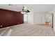 Primary bedroom with ceiling fan and an accent wall at 11015 Dornoch Castle St, Las Vegas, NV 89141