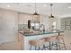 Modern kitchen with island, stainless steel appliances, and ample cabinet space at 129 Barringswell Ave, Henderson, NV 89011