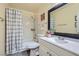 Clean bathroom with a shower/tub combo and white vanity at 1301 Pinto Rock Dr # 201, Las Vegas, NV 89128