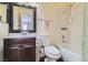 Bathroom with a tub, shower, and dark brown vanity at 1301 Pinto Rock Dr # 201, Las Vegas, NV 89128