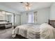 Spacious bedroom with mirrored closet doors and a ceiling fan at 1301 Pinto Rock Dr # 201, Las Vegas, NV 89128