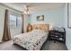 Bedroom with a wooden headboard and floral bedding at 1301 Pinto Rock Dr # 201, Las Vegas, NV 89128