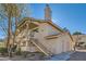 Exterior view of a two-story condo with stairs leading to the entrance and a satellite dish at 1301 Pinto Rock Dr # 201, Las Vegas, NV 89128