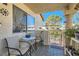 Relaxing patio with small table and chairs, offering a view of the landscaped yard at 1301 Pinto Rock Dr # 201, Las Vegas, NV 89128