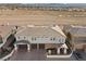 Contemporary home's roofline, three-car garage, and landscaping at 1319 Red Baron Ln, Boulder City, NV 89005