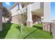 Landscaped backyard with artificial turf at 1319 Red Baron Ln, Boulder City, NV 89005
