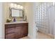 Clean bathroom with glass block shower and modern vanity at 1319 Red Baron Ln, Boulder City, NV 89005