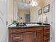 Bathroom with dark wood vanity and granite countertop at 1319 Red Baron Ln, Boulder City, NV 89005