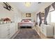 Spacious bedroom with a comfy bed and plenty of dresser storage at 1319 Red Baron Ln, Boulder City, NV 89005
