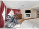 Relaxing bedroom with TV, exercise equipment, and large window at 1319 Red Baron Ln, Boulder City, NV 89005