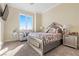 Guest bedroom with mirrored headboard and comfortable sitting area at 1319 Red Baron Ln, Boulder City, NV 89005