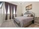 Elegant bedroom with large bed, plush bedding, and plenty of light at 1319 Red Baron Ln, Boulder City, NV 89005