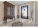 Elegant entryway with a decorative tile floor and ornate cabinet at 1319 Red Baron Ln, Boulder City, NV 89005