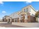 Modern three-car garage home with stone and stucco exterior at 1319 Red Baron Ln, Boulder City, NV 89005