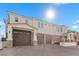Luxury three-car garage home with stone accents and a grand entrance at 1319 Red Baron Ln, Boulder City, NV 89005