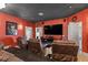 Home theater with large screen, comfortable seating, and dark walls at 1319 Red Baron Ln, Boulder City, NV 89005
