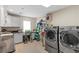 Bright laundry room with washer, dryer, and ample counter space at 1319 Red Baron Ln, Boulder City, NV 89005