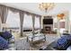 Spacious living room with fireplace and large windows at 1319 Red Baron Ln, Boulder City, NV 89005