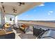 Covered patio with outdoor seating, grill, and scenic views at 1319 Red Baron Ln, Boulder City, NV 89005