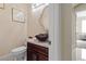 Stylish powder room with dark brown vanity and vessel sink at 1319 Red Baron Ln, Boulder City, NV 89005