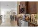 Wet bar with wine rack, sink, mini-fridge, and dark wood cabinets at 1319 Red Baron Ln, Boulder City, NV 89005