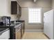 Modern wet bar with dark cabinetry and granite countertops at 1319 Red Baron Ln, Boulder City, NV 89005