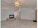 Bright living room with tile floors and a fireplace at 1384 Glassy Pond Ave, Las Vegas, NV 89183