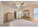 Main bedroom with walk-in closet and ceiling fan at 1570 Raining Hills St, Henderson, NV 89052