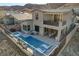 Aerial view of house with pool and spa; backyard patio furniture visible at 1968 Regal Bluff Dr, Henderson, NV 89052