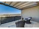 Relaxing balcony with wicker chairs, offering stunning views at 1968 Regal Bluff Dr, Henderson, NV 89052