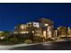 Night view of a modern home's exterior, beautifully lit at 1968 Regal Bluff Dr, Henderson, NV 89052
