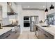 Modern kitchen with stainless steel appliances and dark gray cabinetry at 1968 Regal Bluff Dr, Henderson, NV 89052
