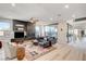 Open living area featuring a sleek fireplace and light-colored floors at 1968 Regal Bluff Dr, Henderson, NV 89052
