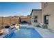 Stunning pool and spa with mountain views and patio seating at 1968 Regal Bluff Dr, Henderson, NV 89052