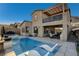 Stunning pool and spa; modern lounge chairs and a spacious patio area at 1968 Regal Bluff Dr, Henderson, NV 89052