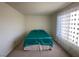 Bedroom with teal bedding and carpet flooring at 2036 Mesquite Ln # 303, Laughlin, NV 89029