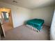 Bright bedroom with teal bedding and carpet flooring at 2036 Mesquite Ln # 303, Laughlin, NV 89029