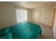 Bedroom with teal bedding, polka dot curtains, and double closets at 2036 Mesquite Ln # 303, Laughlin, NV 89029