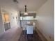 Modern dining area with glass top table and white chairs at 2036 Mesquite Ln # 303, Laughlin, NV 89029