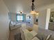 Bright dining area with glass table and chairs, open to living room at 2036 Mesquite Ln # 303, Laughlin, NV 89029