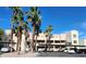 Attractive exterior of a two-story condo building with palm trees and ample parking at 2036 Mesquite Ln # 303, Laughlin, NV 89029