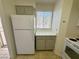 White refrigerator and taupe cabinets in this kitchen at 2036 Mesquite Ln # 303, Laughlin, NV 89029
