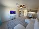 Open living area with sectional sofa, dining area, and kitchen view at 2036 Mesquite Ln # 303, Laughlin, NV 89029