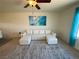 Living room features a white sectional sofa and large wave art at 2036 Mesquite Ln # 303, Laughlin, NV 89029