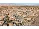 Aerial view of a residential neighborhood with houses and desert landscape at 2149 Cedar River Ct, Henderson, NV 89044