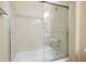 Clean bathroom with a tub and sliding glass door at 2149 Cedar River Ct, Henderson, NV 89044