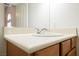 Bathroom vanity with a single sink and wood cabinets at 2149 Cedar River Ct, Henderson, NV 89044