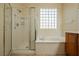 Bathroom features shower, bathtub, and a window at 2149 Cedar River Ct, Henderson, NV 89044