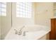 Close-up of bathtub with modern chrome fixtures at 2149 Cedar River Ct, Henderson, NV 89044